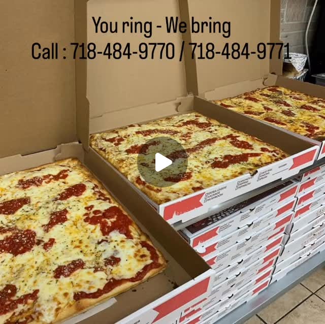 Stack of large cheese pies ready for delivery